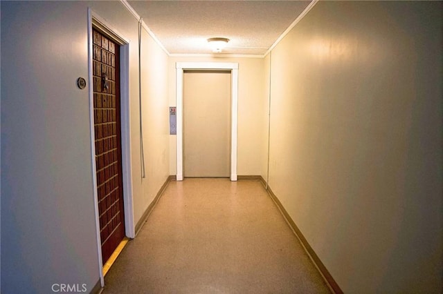 corridor featuring baseboards and ornamental molding