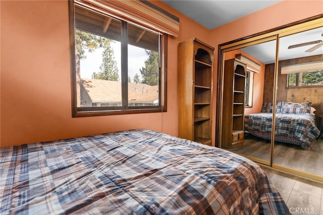 bedroom with a closet and wood finished floors