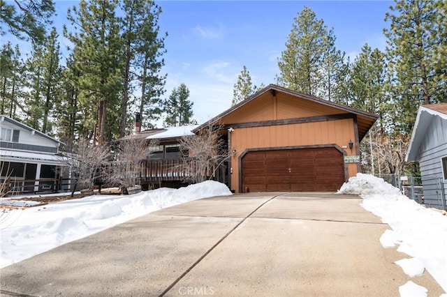 view of front of home with concrete driveway and a garage