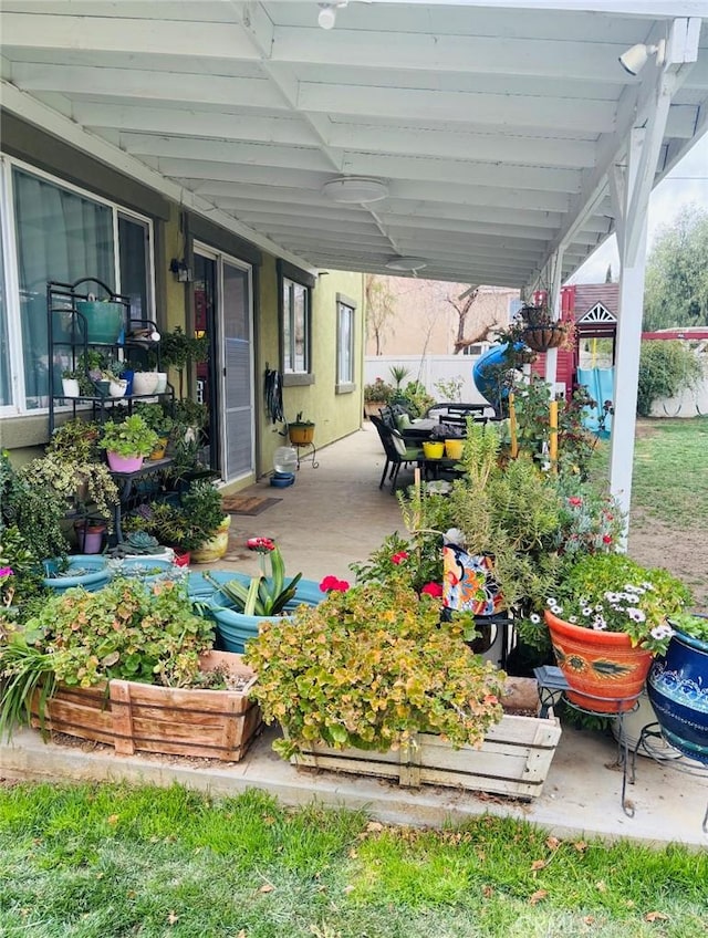 view of patio / terrace featuring an attached carport