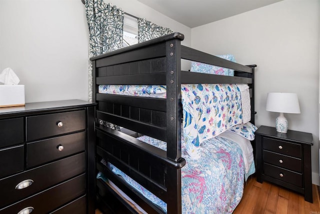 bedroom with wood finished floors