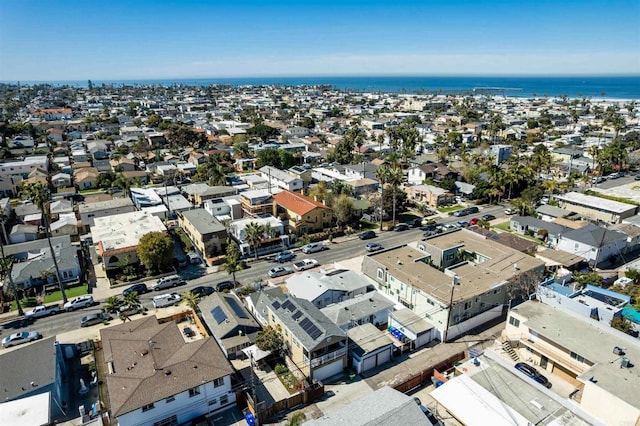 drone / aerial view with a residential view and a water view