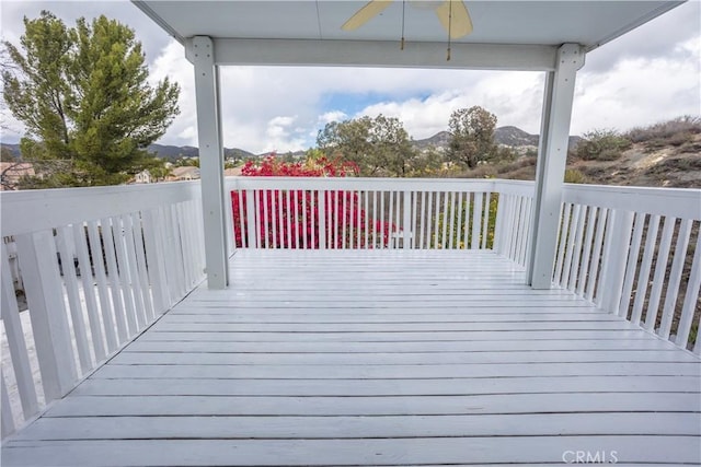 wooden deck with ceiling fan