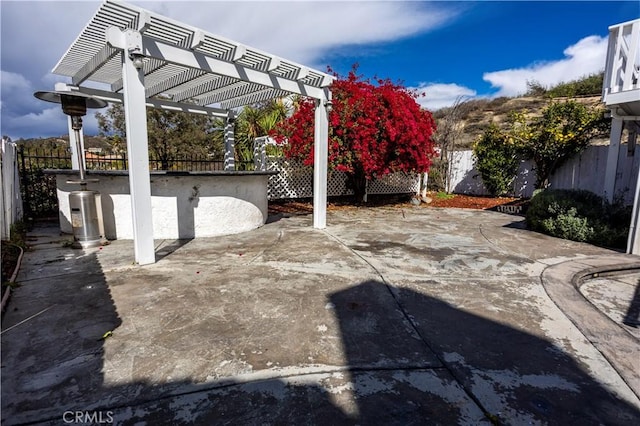 view of patio featuring a fenced backyard and a pergola