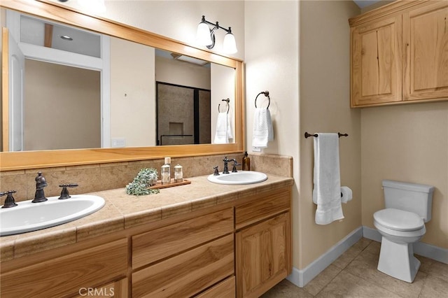 13725 Nimshew Rd, Magalia, CA 95954 - full bathroom featuring tile patterned floors, double vanity, toilet, and a sink