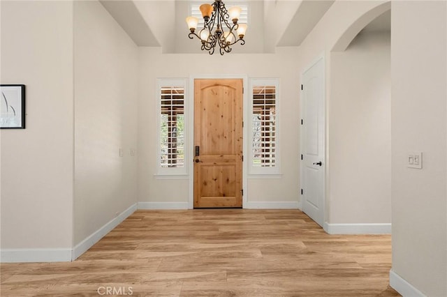 13725 Nimshew Rd, Magalia, CA 95954 - entryway featuring baseboards, arched walkways, and light wood-style flooring
