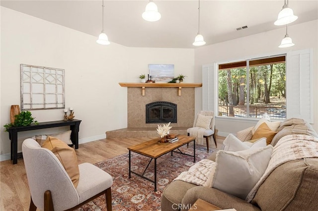 13725 Nimshew Rd, Magalia, CA 95954 - living room with visible vents, a fireplace, baseboards, and wood finished floors