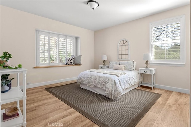 13725 Nimshew Rd, Magalia, CA 95954 - bedroom with multiple windows, baseboards, and light wood-style floors