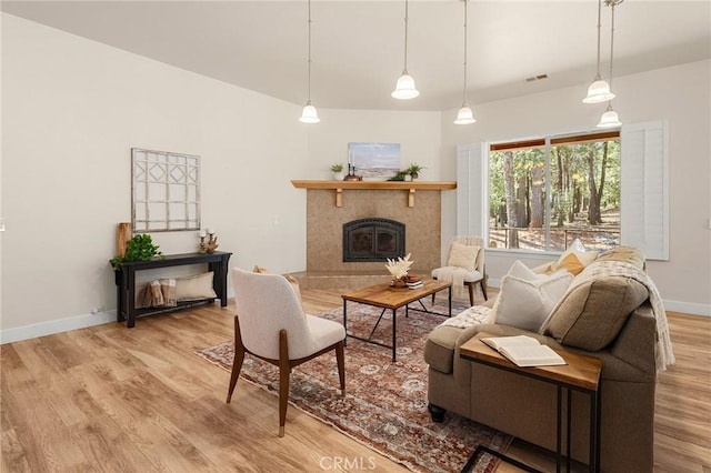 13725 Nimshew Rd, Magalia, CA 95954 - living area featuring wood finished floors, visible vents, a high end fireplace, and baseboards