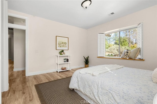 13725 Nimshew Rd, Magalia, CA 95954 - bedroom with visible vents, wood finished floors, and baseboards