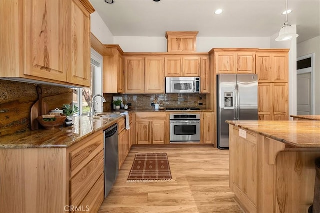 13725 Nimshew Rd, Magalia, CA 95954 - kitchen with light brown cabinets, dark stone counters, decorative backsplash, appliances with stainless steel finishes, and a sink