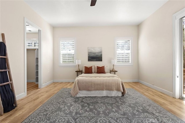 13725 Nimshew Rd, Magalia, CA 95954 - bedroom with multiple windows, baseboards, and wood finished floors