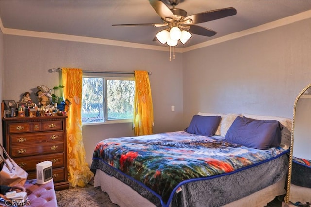 bedroom featuring a ceiling fan, crown molding, and carpet