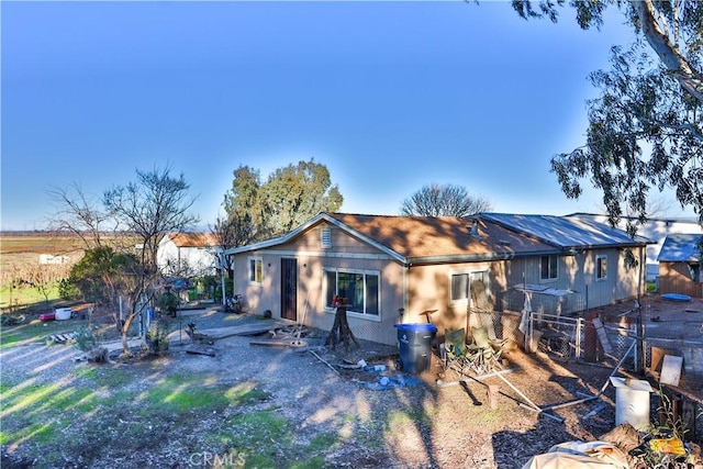 back of property with fence