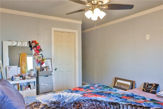 bedroom featuring crown molding and a ceiling fan