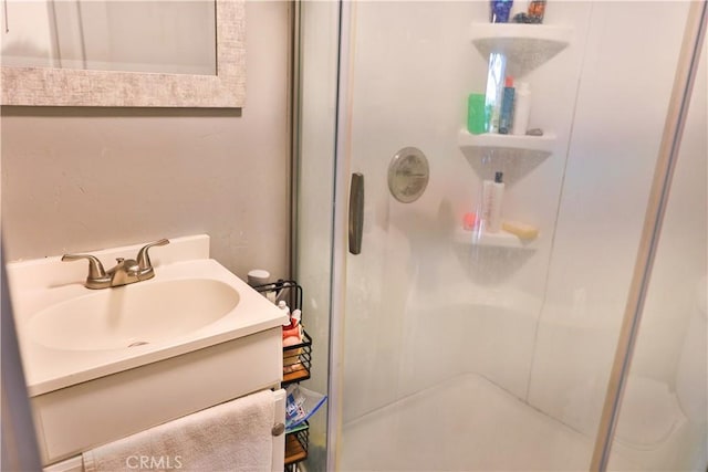 full bath featuring vanity and a stall shower