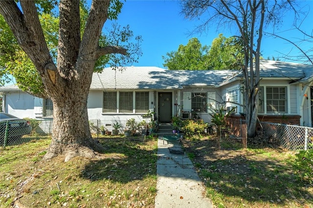 view of front of house with fence