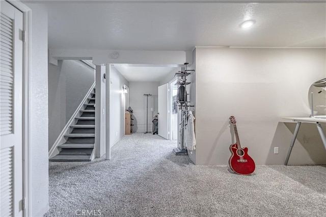 hallway with carpet and stairs