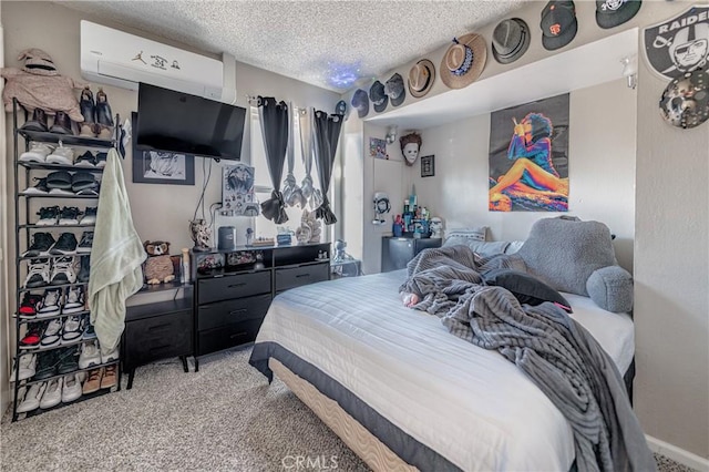 carpeted bedroom with an AC wall unit and a textured ceiling