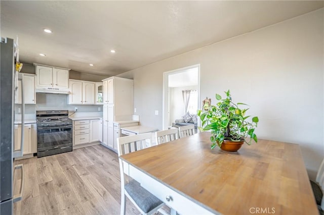 dining room featuring recessed lighting and light wood-style floors