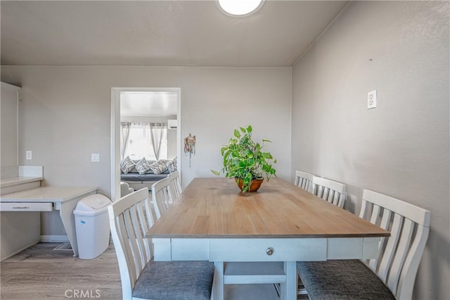 dining space featuring light wood-type flooring