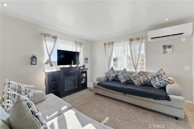 carpeted living area featuring recessed lighting, baseboards, and a wall mounted AC