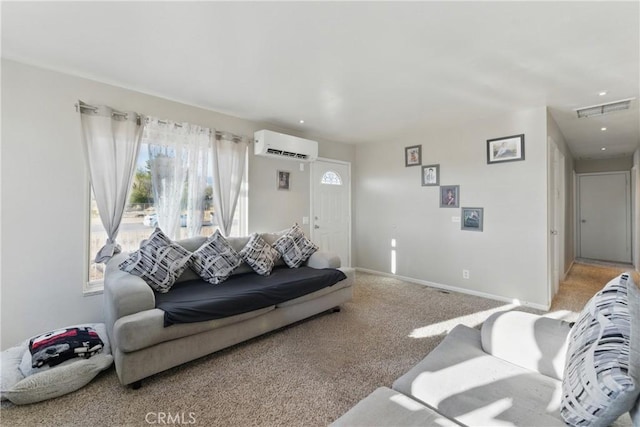 living area with an AC wall unit, light colored carpet, visible vents, and baseboards