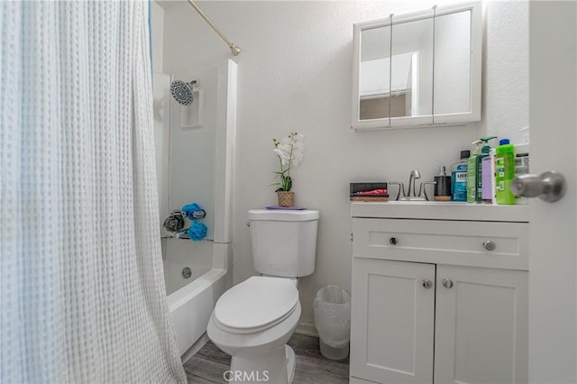 bathroom featuring toilet, vanity, and shower / bath combination with curtain