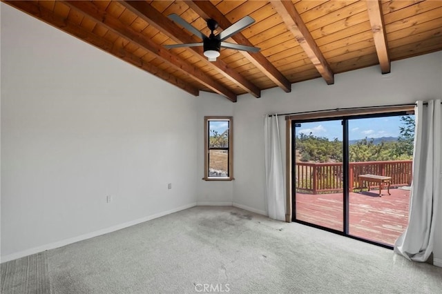 carpeted spare room featuring lofted ceiling with beams, baseboards, wooden ceiling, and a ceiling fan