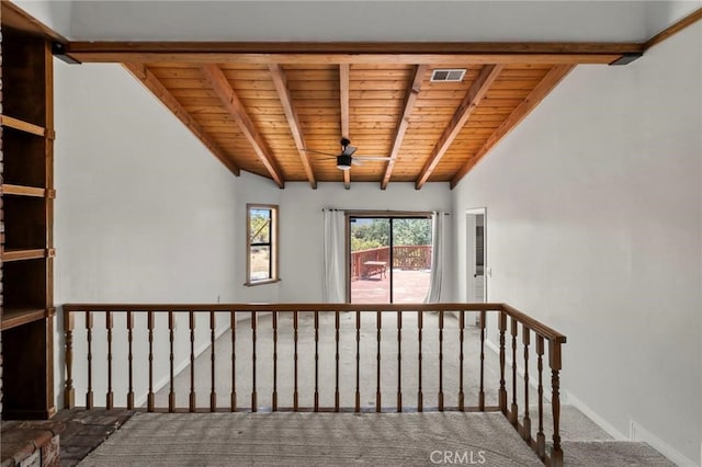 stairs with visible vents, carpet floors, wooden ceiling, baseboards, and vaulted ceiling with beams