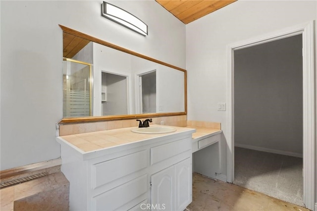 full bath with an enclosed shower, concrete flooring, and vanity