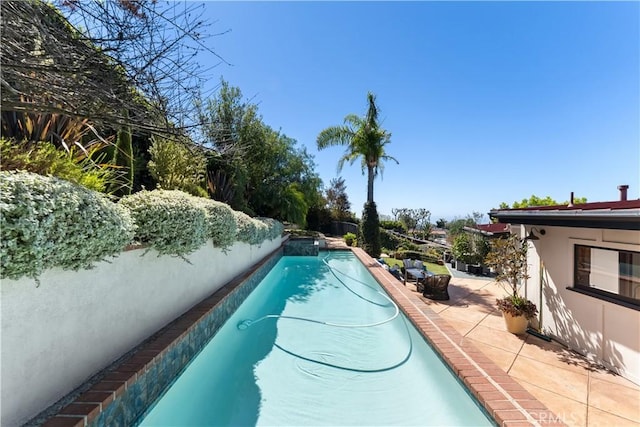 outdoor pool featuring a patio area