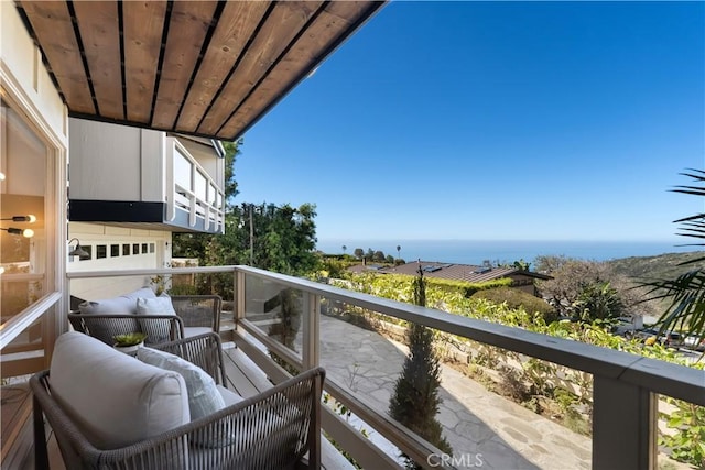 balcony featuring a water view