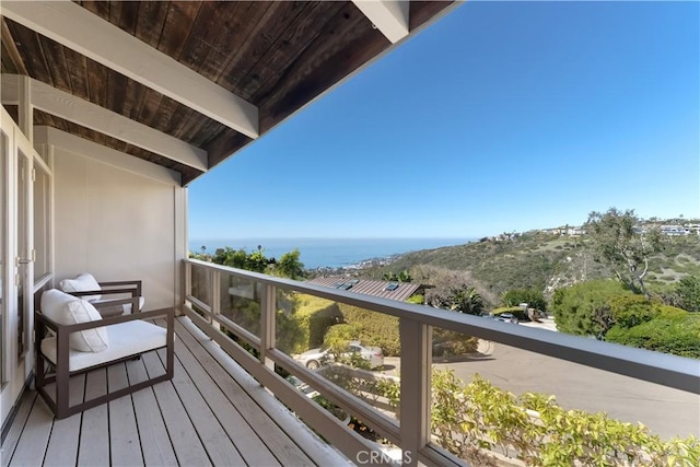 balcony featuring a water view