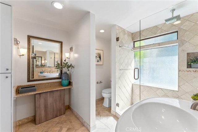 full bathroom featuring baseboards, recessed lighting, a stall shower, tile patterned floors, and toilet