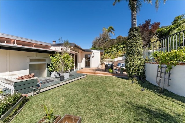 view of yard with a patio and fence