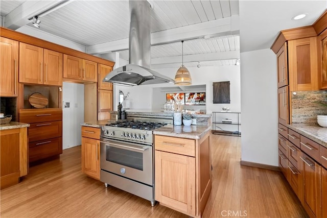 kitchen featuring stainless steel range, beamed ceiling, island exhaust hood, and light wood finished floors