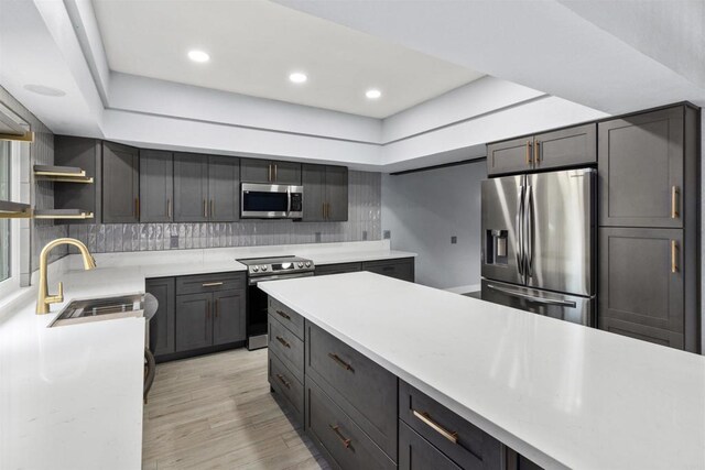 32404 Womsi Rd, Pauma Valley, CA 92061 - kitchen featuring stainless steel appliances, light countertops, tasteful backsplash, light wood-type flooring, and recessed lighting