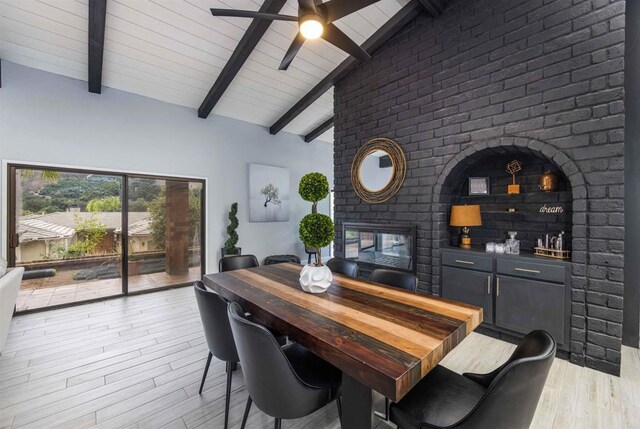 32404 Womsi Rd, Pauma Valley, CA 92061 - dining space featuring a multi sided fireplace, light wood-type flooring, and a ceiling fan