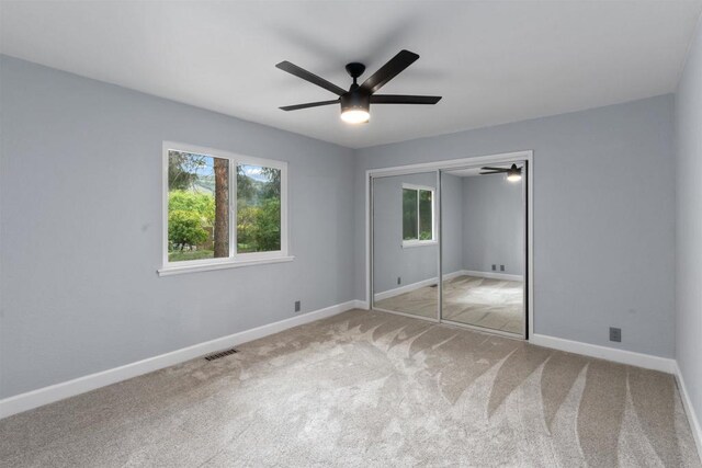 32404 Womsi Rd, Pauma Valley, CA 92061 - unfurnished bedroom featuring carpet, a closet, and a ceiling fan