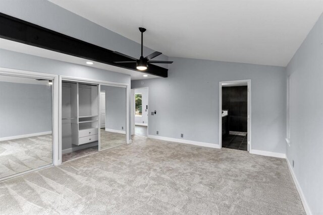 32404 Womsi Rd, Pauma Valley, CA 92061 - unfurnished bedroom featuring multiple closets, light carpet, lofted ceiling, ensuite bathroom, and ceiling fan