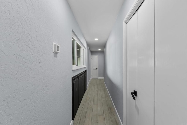 32404 Womsi Rd, Pauma Valley, CA 92061 - corridor featuring light wood-style flooring, a textured wall, and recessed lighting