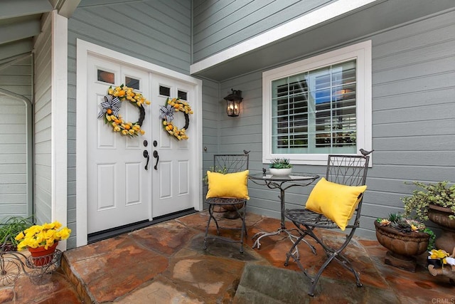 property entrance with covered porch