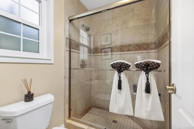 full bath with a shower stall and toilet