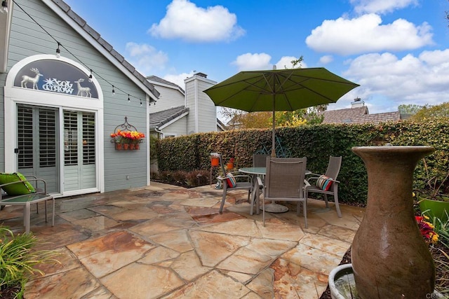 view of patio featuring outdoor dining area