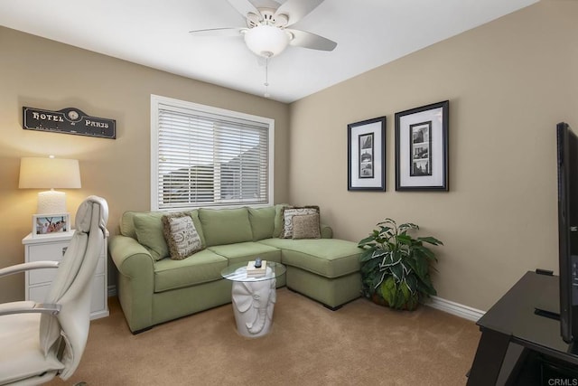 carpeted living room with baseboards and ceiling fan