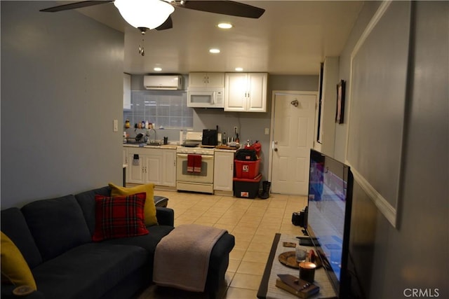 living area with recessed lighting, ceiling fan, light tile patterned flooring, and a wall mounted AC