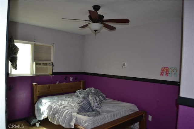 bedroom with cooling unit and a ceiling fan