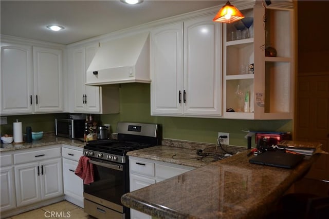 kitchen featuring white cabinetry, custom exhaust hood, and appliances with stainless steel finishes