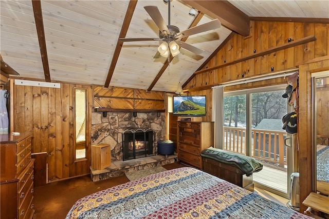 carpeted bedroom featuring access to outside, lofted ceiling with beams, wooden walls, wooden ceiling, and a fireplace